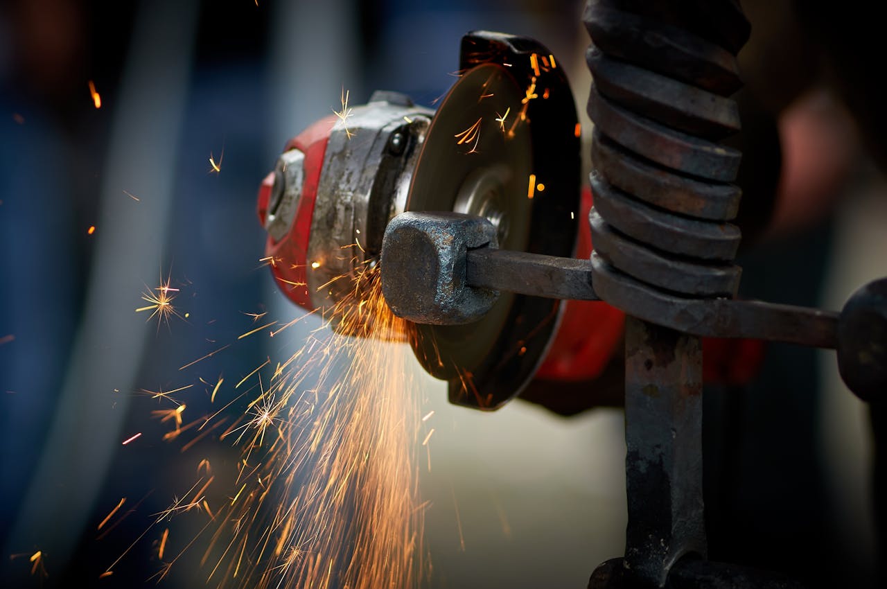digital Dynamic close-up of an angle grinder in action, emitting bright sparks as it shapes metal.